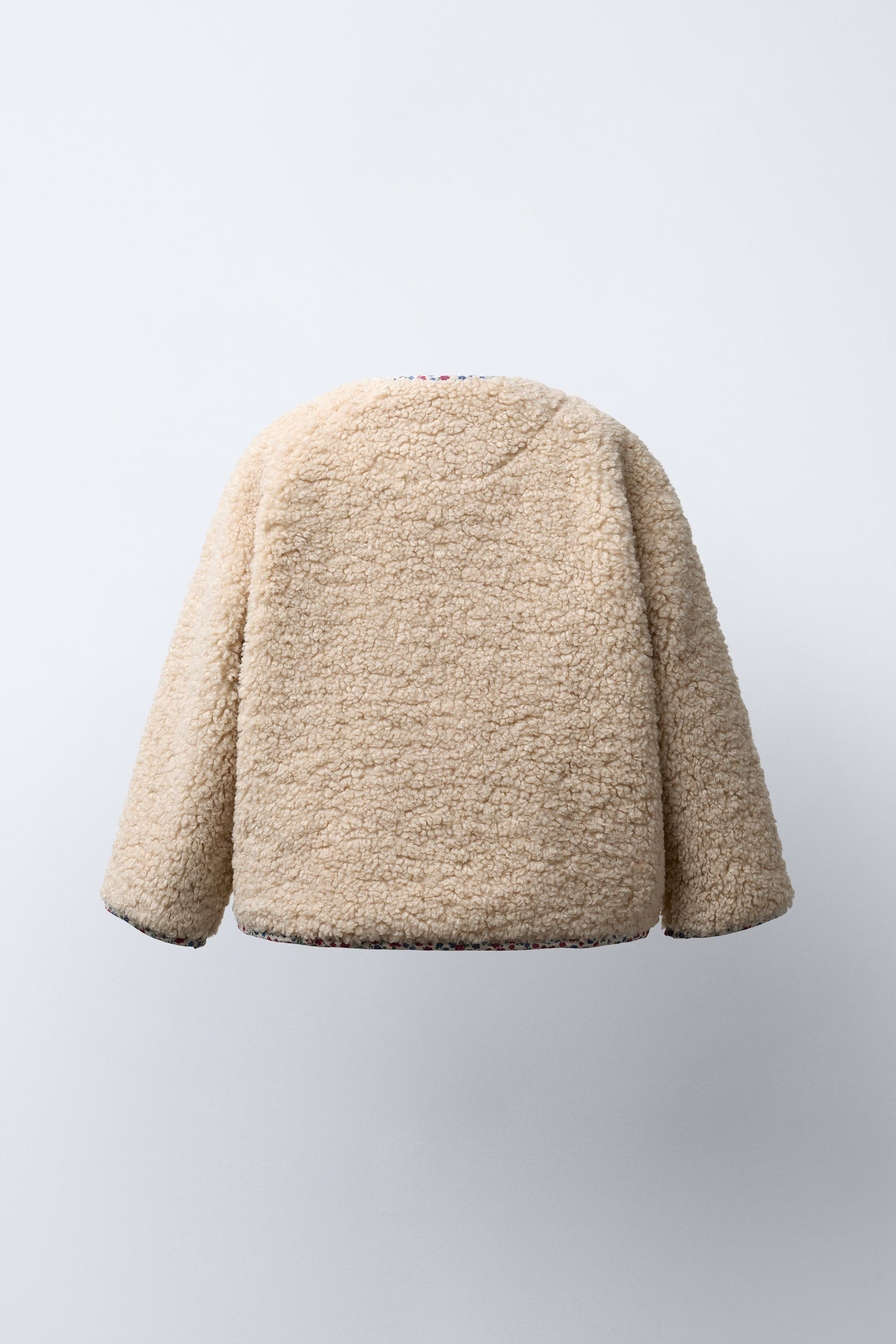 VESTE EFFET MOUTON À LISERÉS FLEURIS